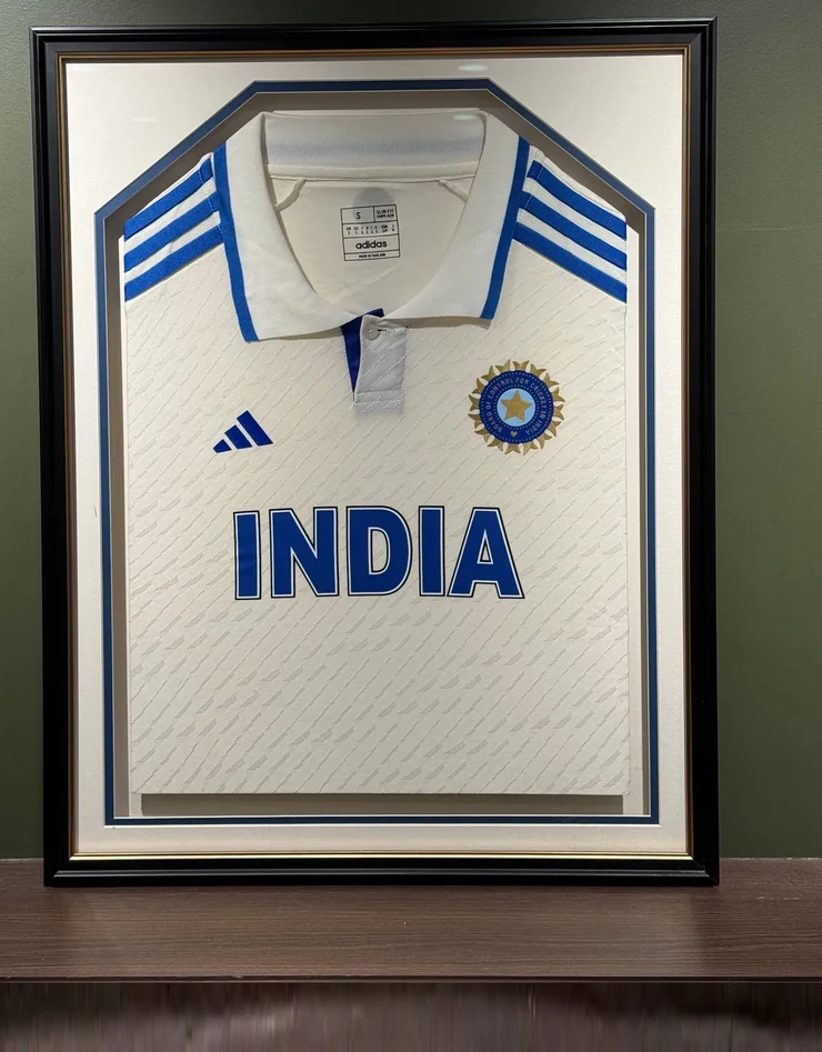 Cricket jersey box-framed in matt black with a deep mount